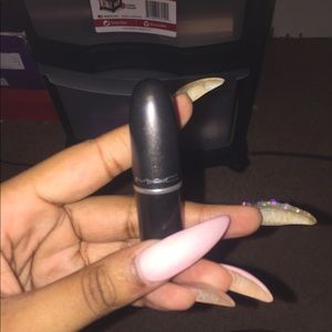 Mac lipstick in the color “Please Me”